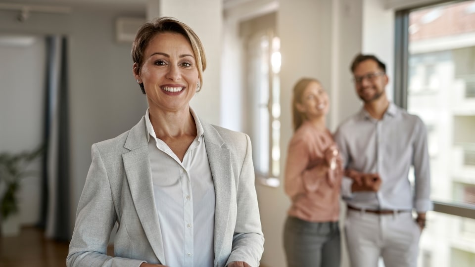 real estate agent and tenants in the background